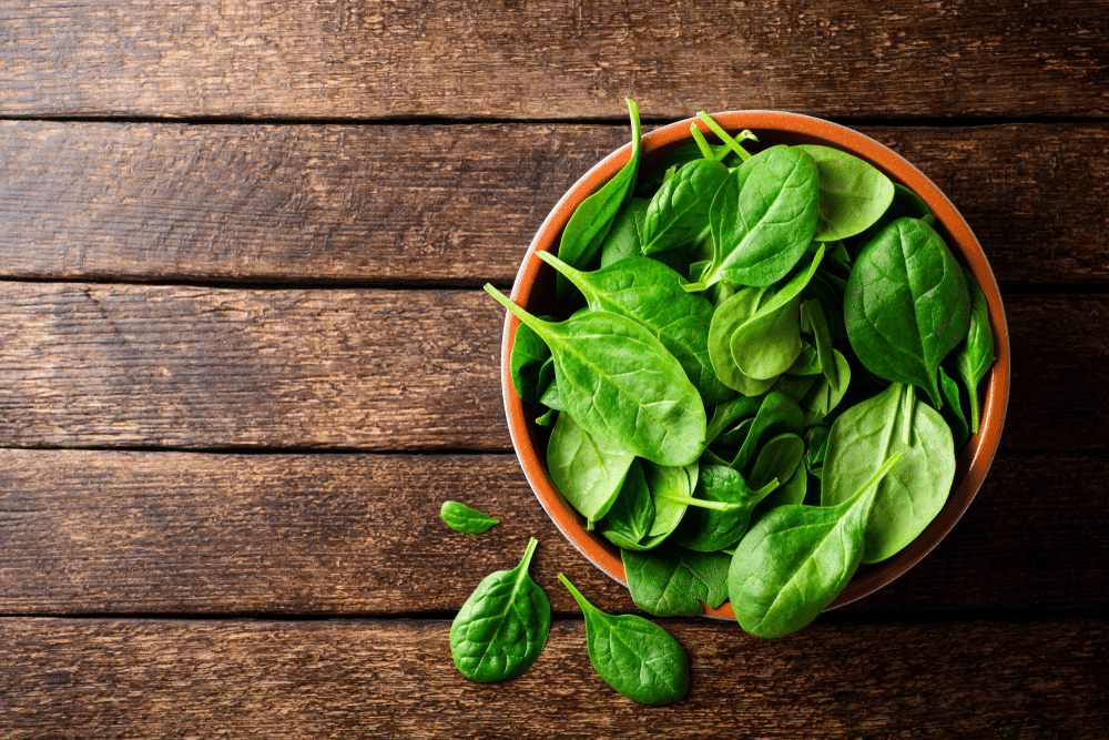 Spinach Bowl on wooden table 
