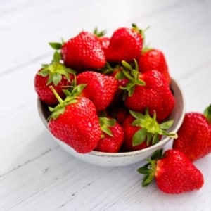 strawberries in white bowl